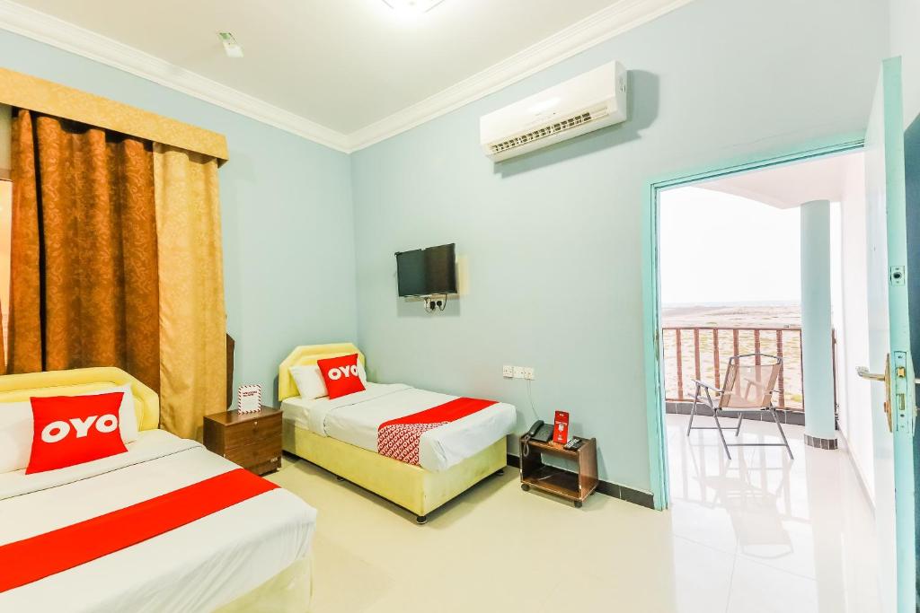 Postel nebo postele na pokoji v ubytování Super OYO 110 Ras Al Hadd Guest House