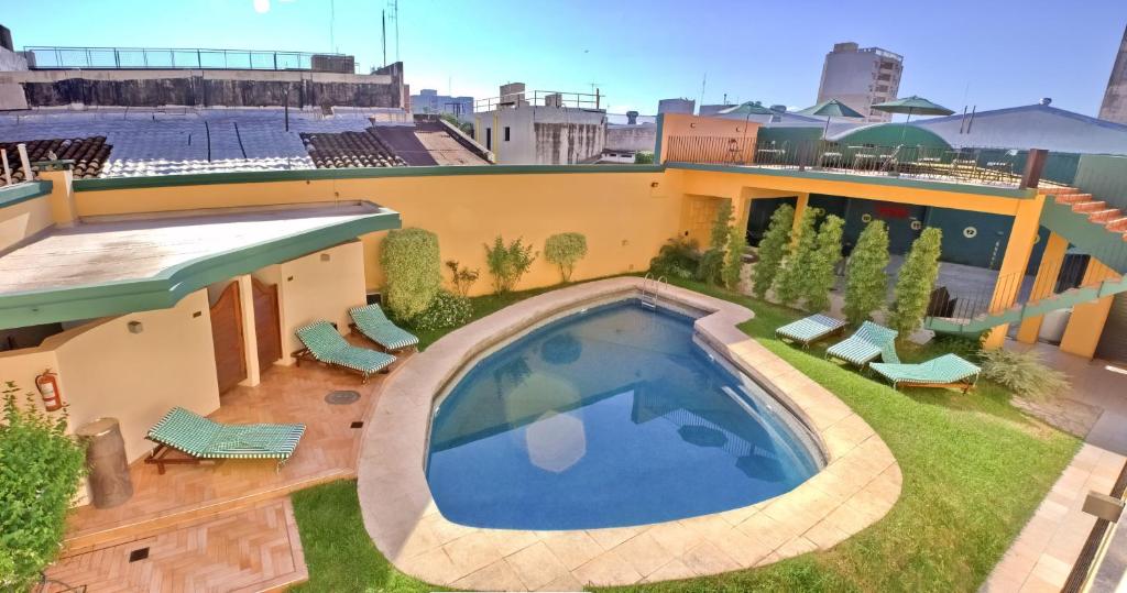 a swimming pool on the roof of a building at Corrientes Plaza Hotel in Corrientes