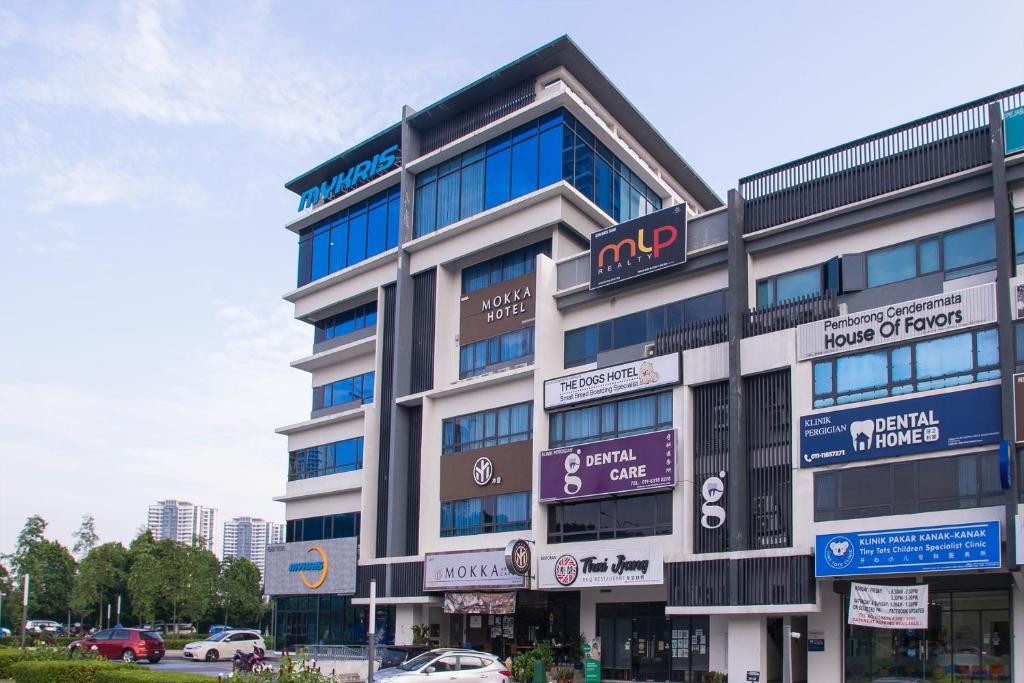 a large building with signs on the side of it at Hotel O Mokka Hotel in Kuala Lumpur