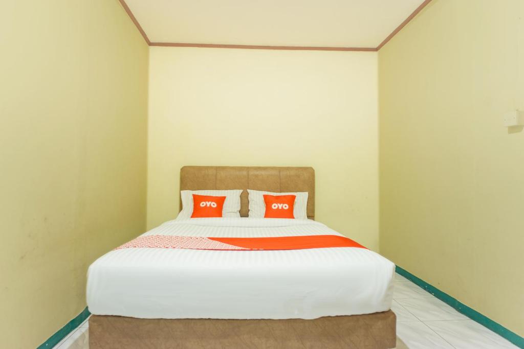 Postel nebo postele na pokoji v ubytování OYO 2180 Vina Vira Hotel