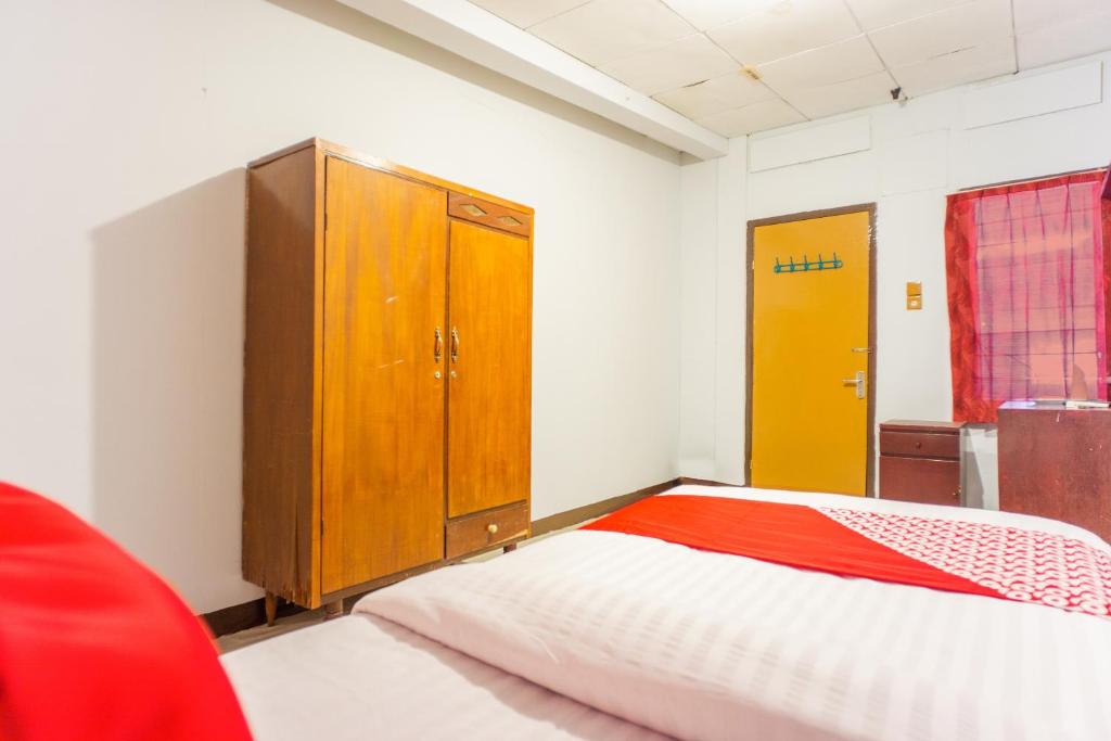 Postel nebo postele na pokoji v ubytování OYO 2180 Vina Vira Hotel
