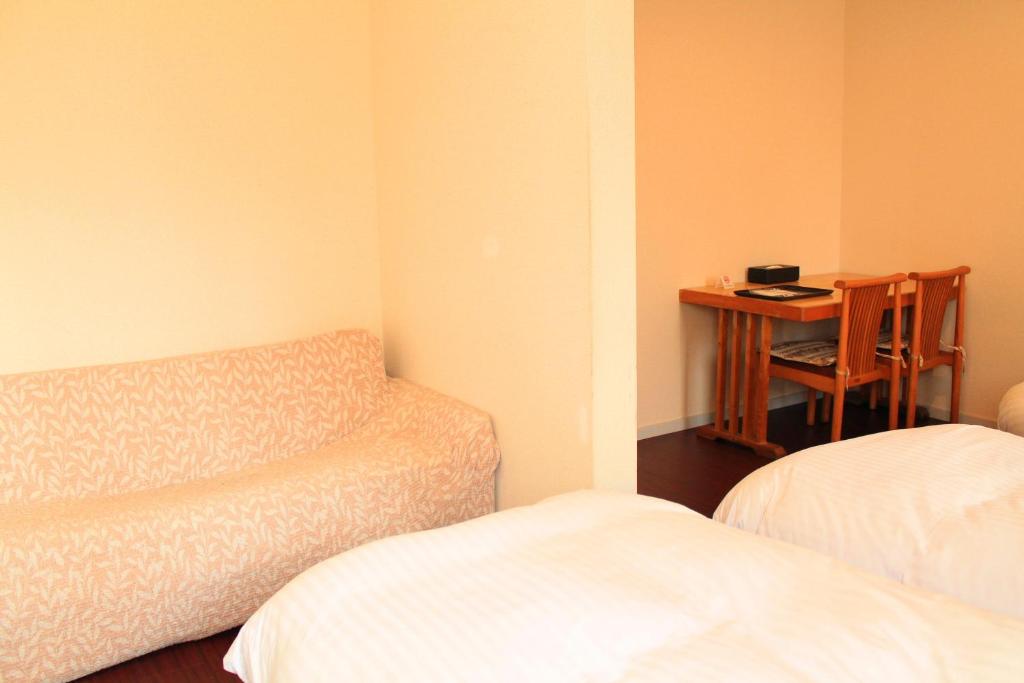 Postel nebo postele na pokoji v ubytování 彩の宿楓泉