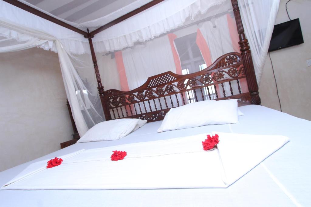 Postel nebo postele na pokoji v ubytování Jannataan Hotel