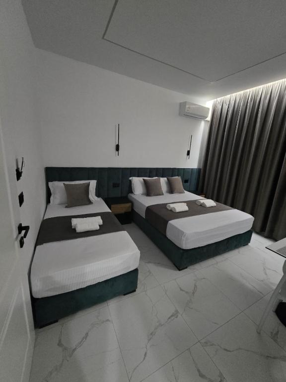 Postel nebo postele na pokoji v ubytování Elite Inn