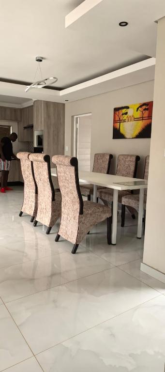 a group of chairs around a table in a room at Ee40Yethu in Pretoria