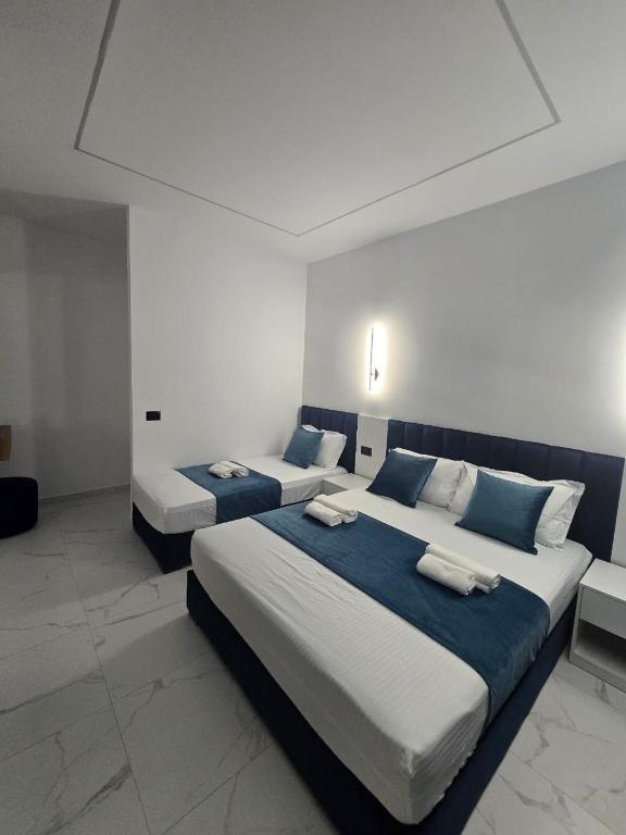 Postel nebo postele na pokoji v ubytování Elite Inn