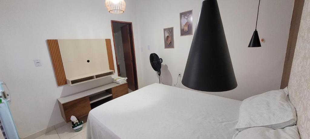 Postel nebo postele na pokoji v ubytování Recanto do Mar