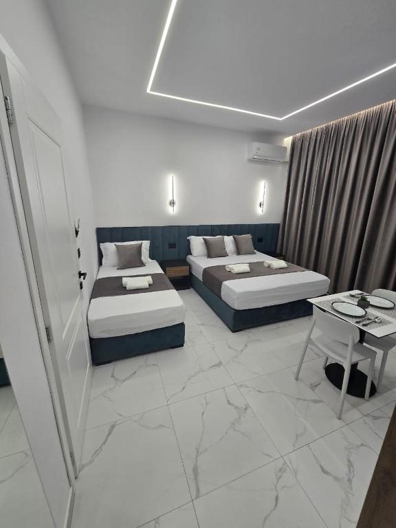 Postel nebo postele na pokoji v ubytování Elite Inn