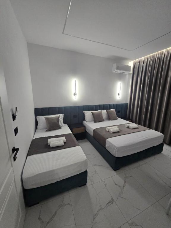Postel nebo postele na pokoji v ubytování Elite Inn