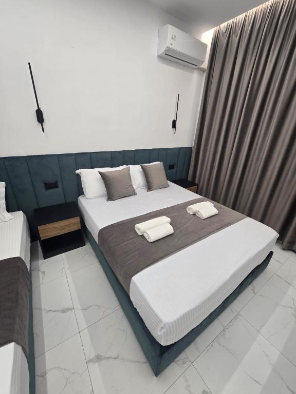 Postel nebo postele na pokoji v ubytování Elite Inn