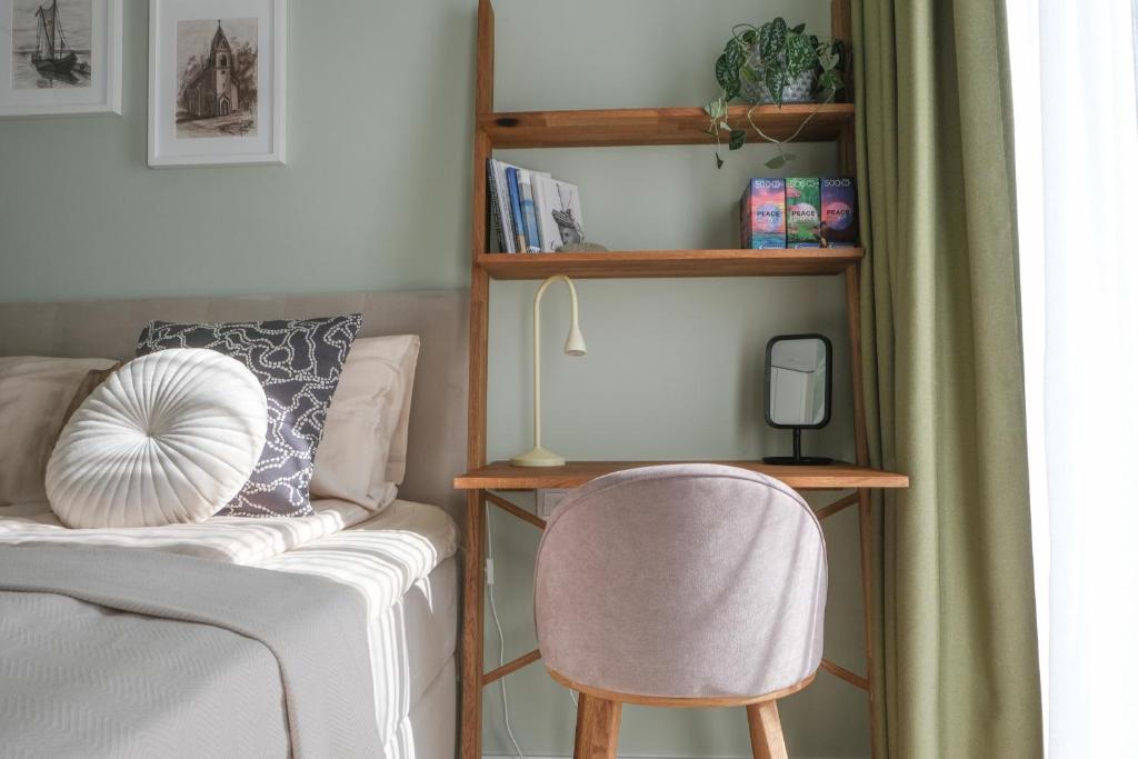Postel nebo postele na pokoji v ubytování Neringarent STUDIO-APARTAMENTAI