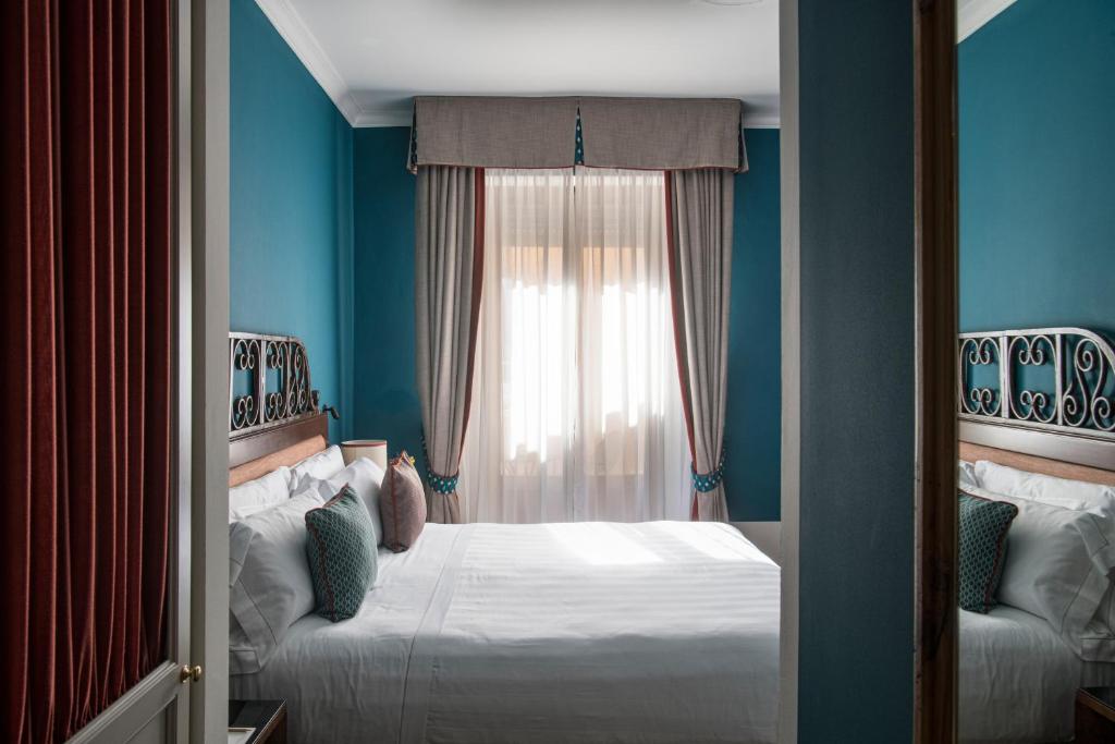 Postel nebo postele na pokoji v ubytování La Posta Hotel & Thermal Spa