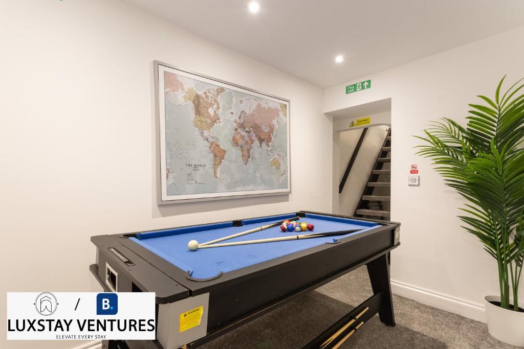 a room with a pool table and a map at Bright and Spacious 2BR Maisonette Sleeps 8, Game Room, 5 mins to Brighton Beach and City Centre in Brighton & Hove