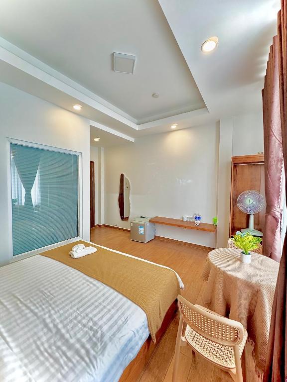 Giường trong phòng chung tại Quang Minh Dalat Hotel