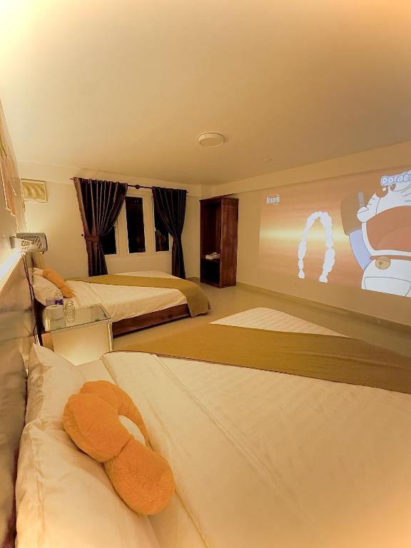 Giường trong phòng chung tại Quang Minh Dalat Hotel