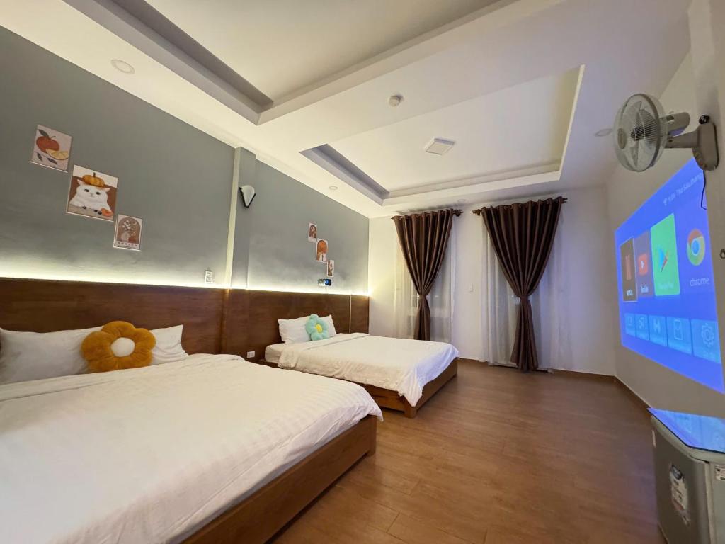 Giường trong phòng chung tại Quang Minh Dalat Hotel