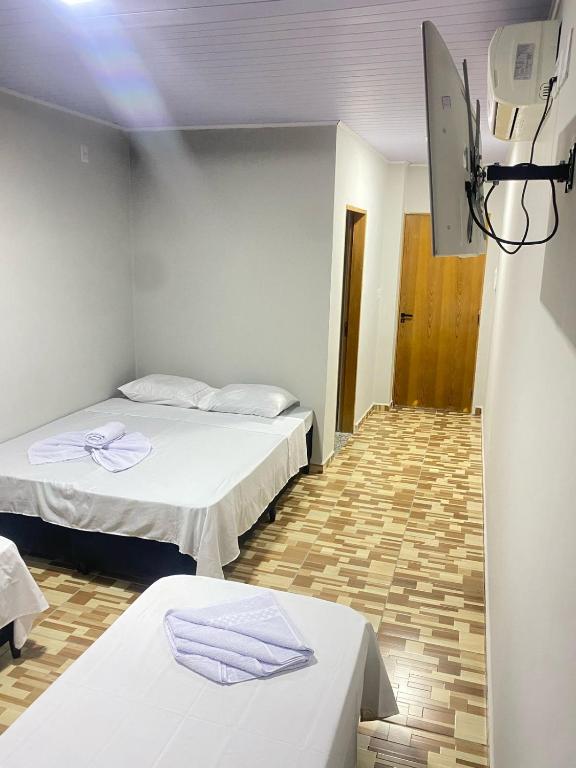 Postel nebo postele na pokoji v ubytování Pousada Sagrada Devoção