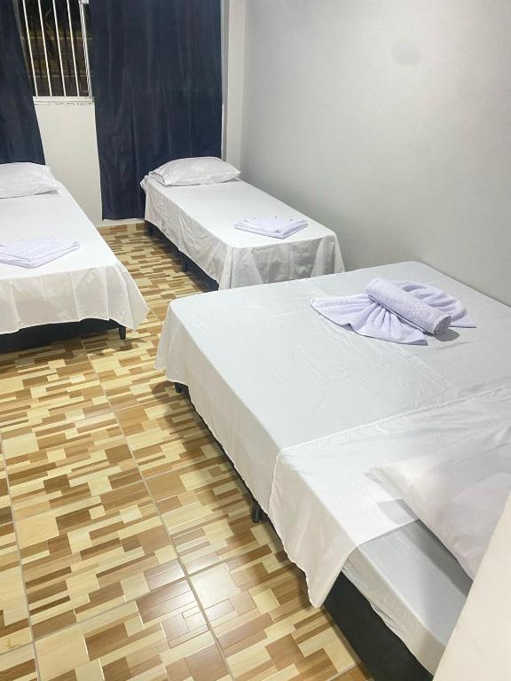 Postel nebo postele na pokoji v ubytování Pousada Sagrada Devoção