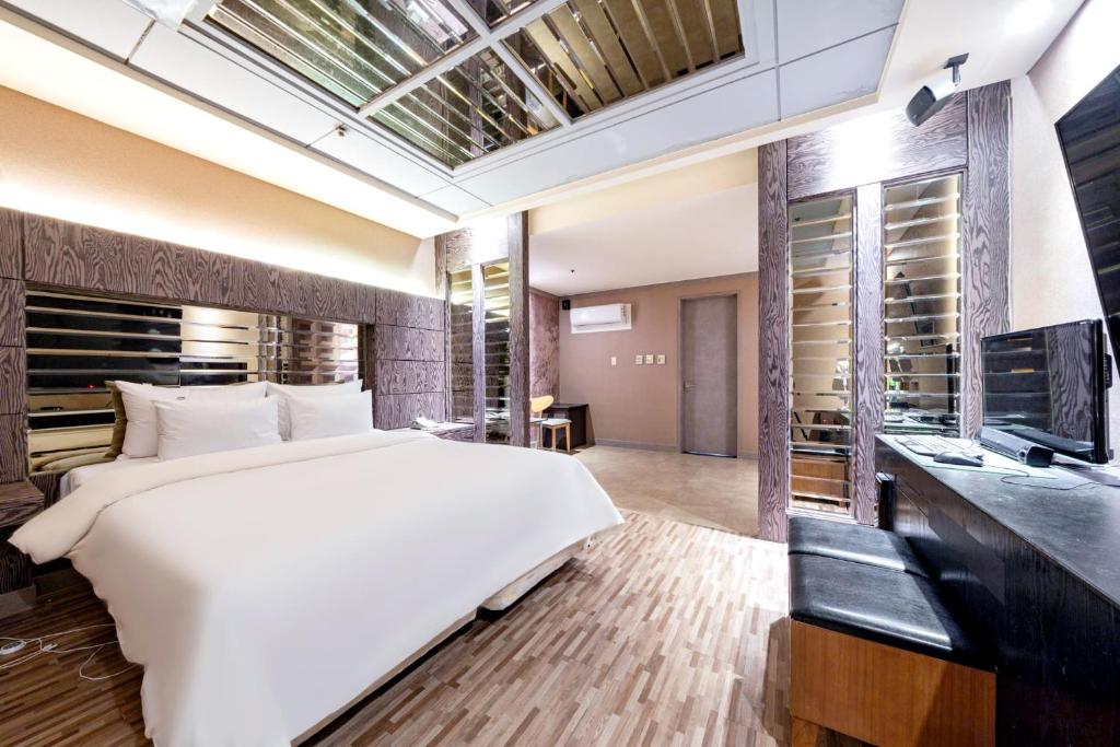 Postel nebo postele na pokoji v ubytování Hotel ON
