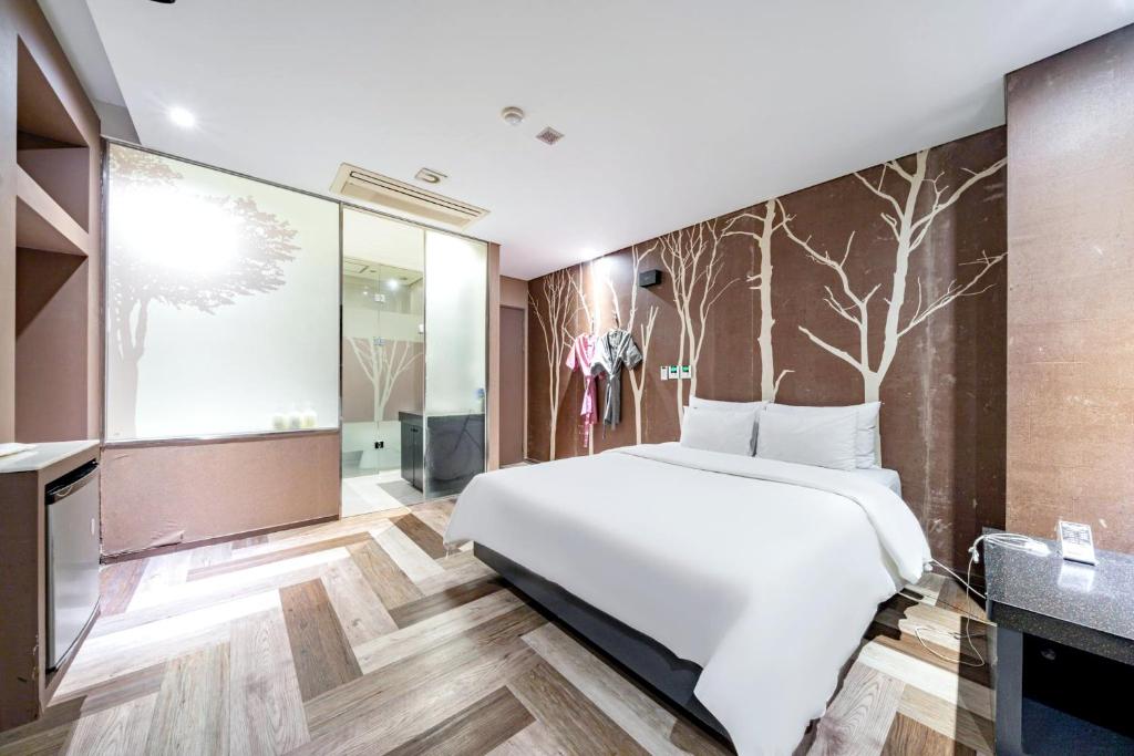 Postel nebo postele na pokoji v ubytování Hotel ON