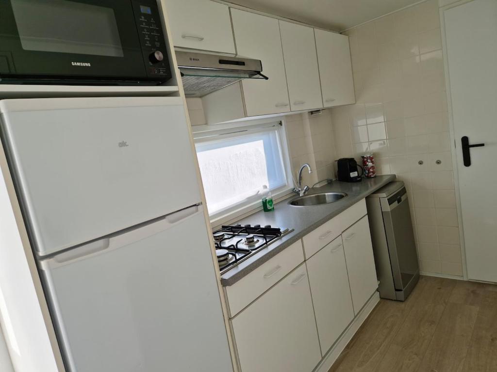 Kuchyň nebo kuchyňský kout v ubytování Chalet T18