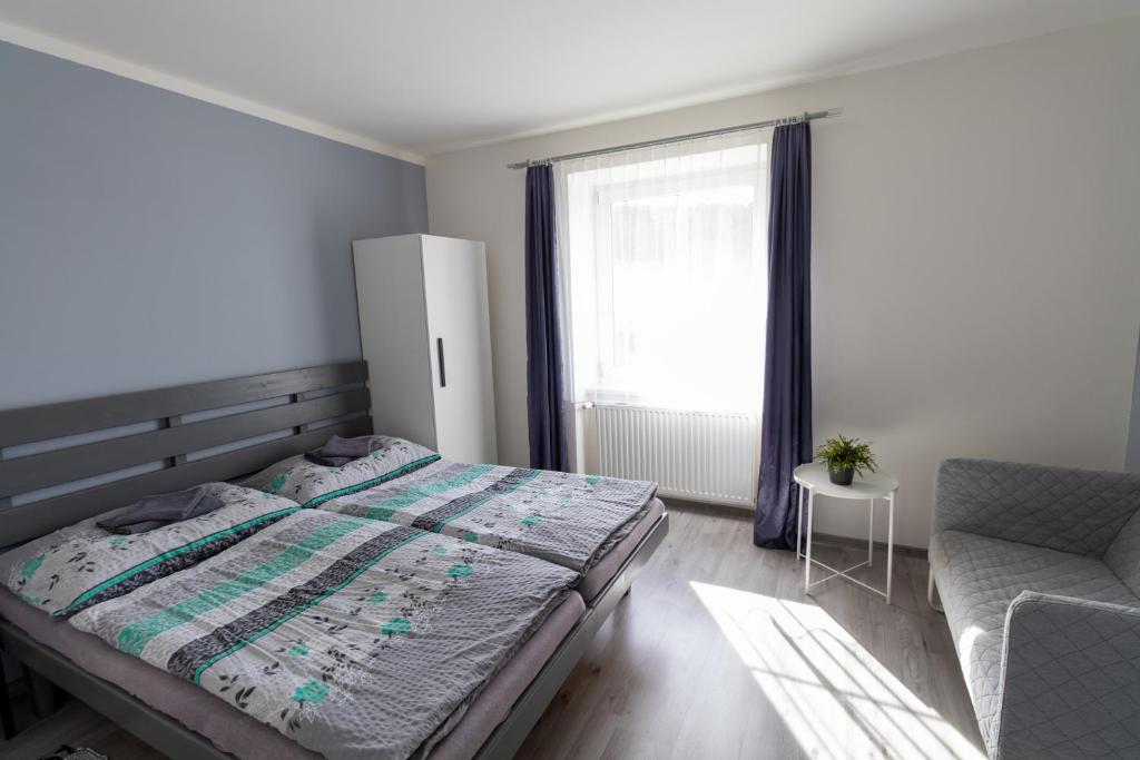 Postel nebo postele na pokoji v ubytování Apartmány Kamejk