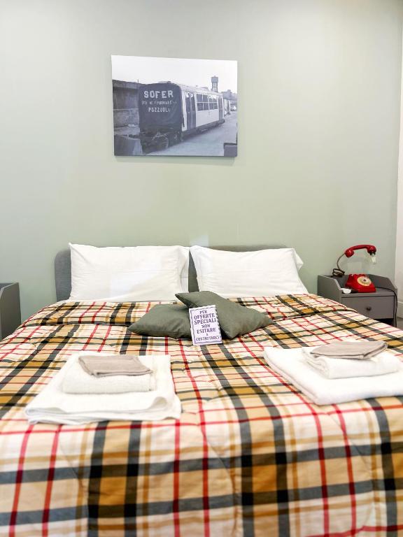 Postel nebo postele na pokoji v ubytování Pozzuoli B&B exSofer