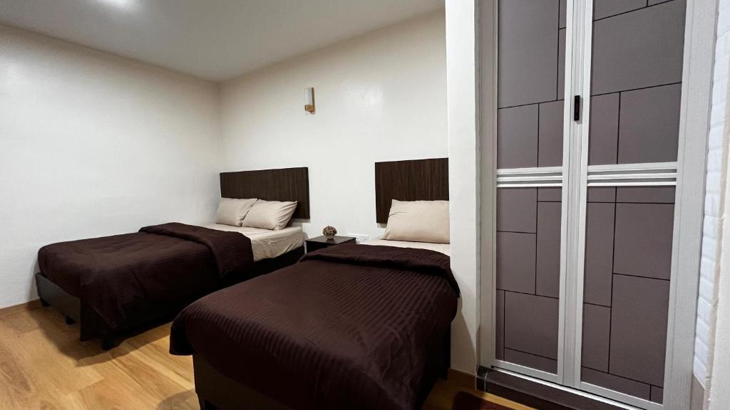 Postel nebo postele na pokoji v ubytování Skye Apartment Hotel