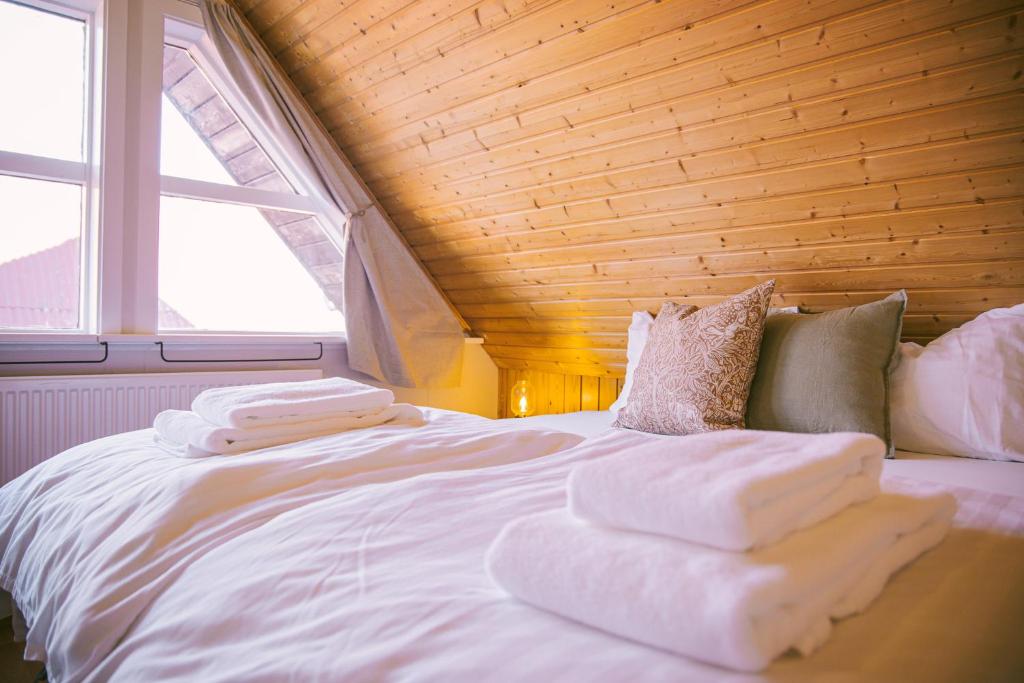 Postel nebo postele na pokoji v ubytování Milli Vina Guesthouse