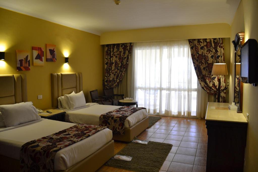 Postel nebo postele na pokoji v ubytování Royal Regency Club - Ultra All Inclusive