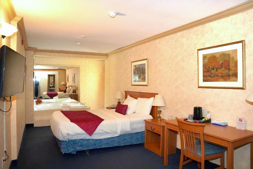 Una cama o camas en una habitación de The Glengate Hotel & Suites