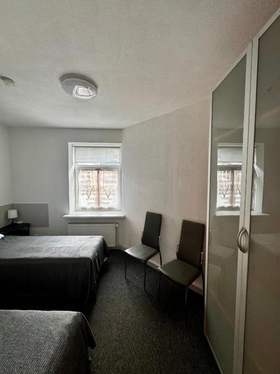 Postel nebo postele na pokoji v ubytování Vecpilsētas hostelis