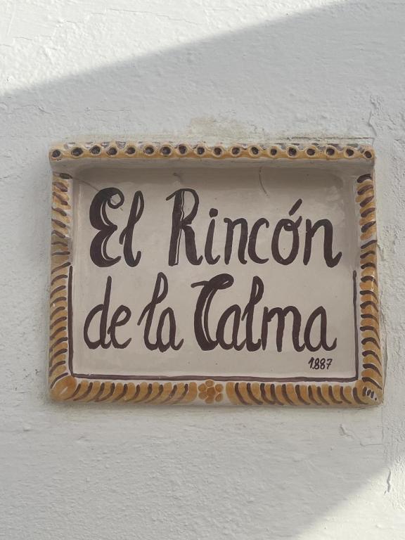 a sign on a wall that says elimaru de la latina at Cueva El Rincón de la Calma in Guadix