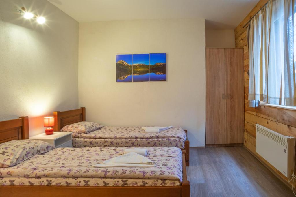 Postel nebo postele na pokoji v ubytování Apartments Peaks