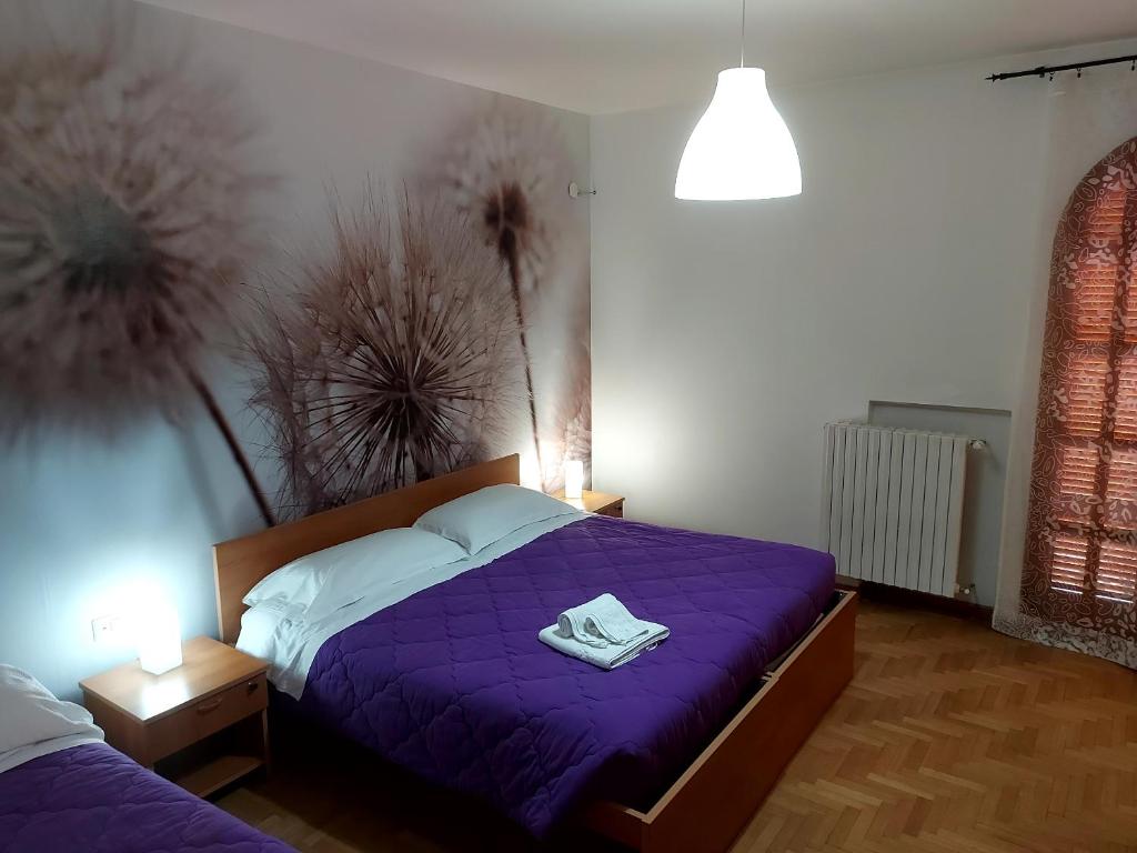 Postel nebo postele na pokoji v ubytování Villa Le Arcate
