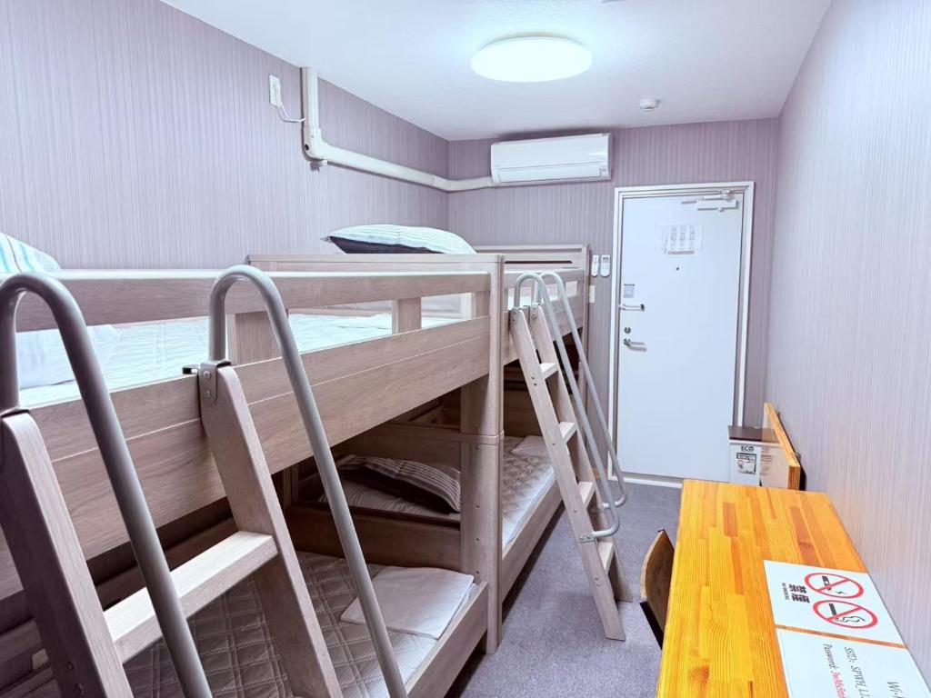Postel nebo postele na pokoji v ubytování HOSTEL s