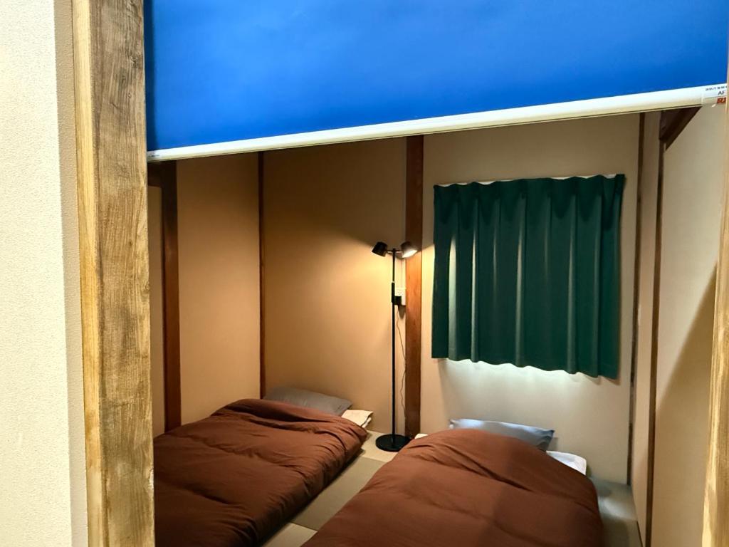 Postel nebo postele na pokoji v ubytování Budget Room JINYA