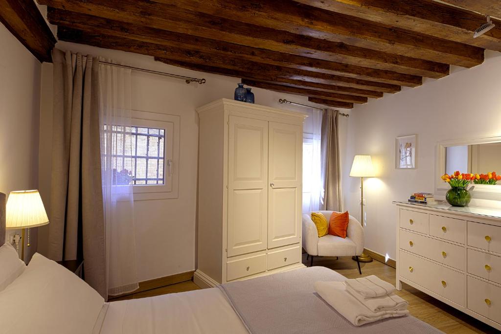 Letto o letti in una camera di Mascherone Apartment