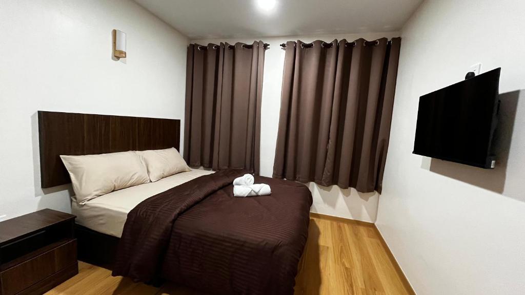 Postel nebo postele na pokoji v ubytování Skye Apartment Hotel