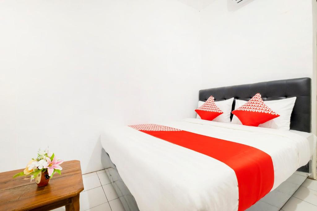 Postel nebo postele na pokoji v ubytování OYO 2394 Hotel Brosta