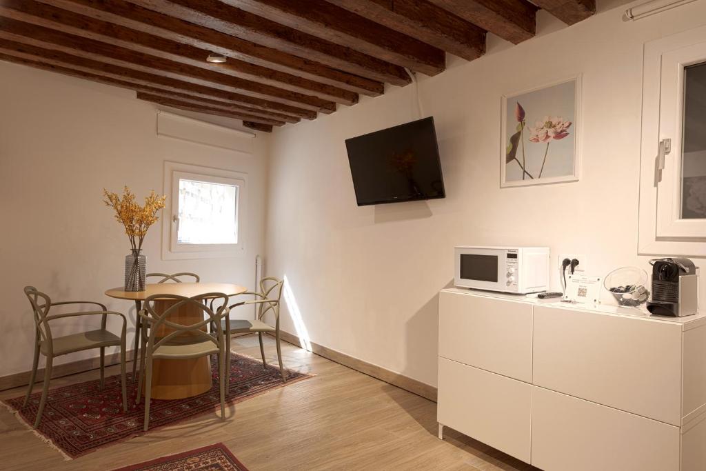 TV o dispositivi per l'intrattenimento presso Mascherone Apartment