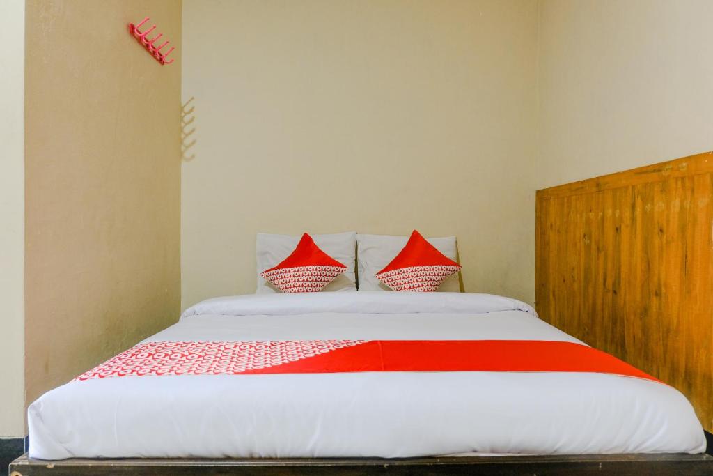 Postel nebo postele na pokoji v ubytování OYO 2643 Hotel Graha Prima