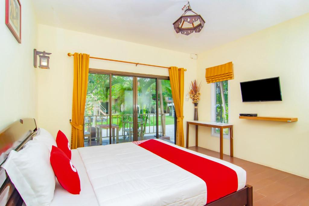 TV a/nebo společenská místnost v ubytování OYO 607 Nawang Resort