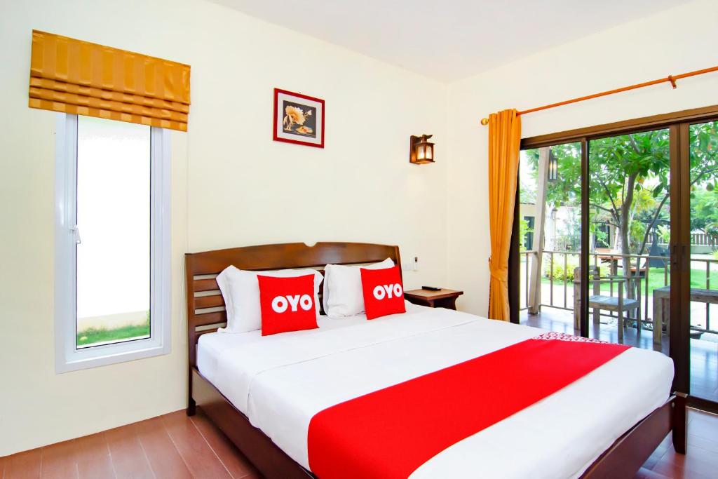 Postel nebo postele na pokoji v ubytování OYO 607 Nawang Resort