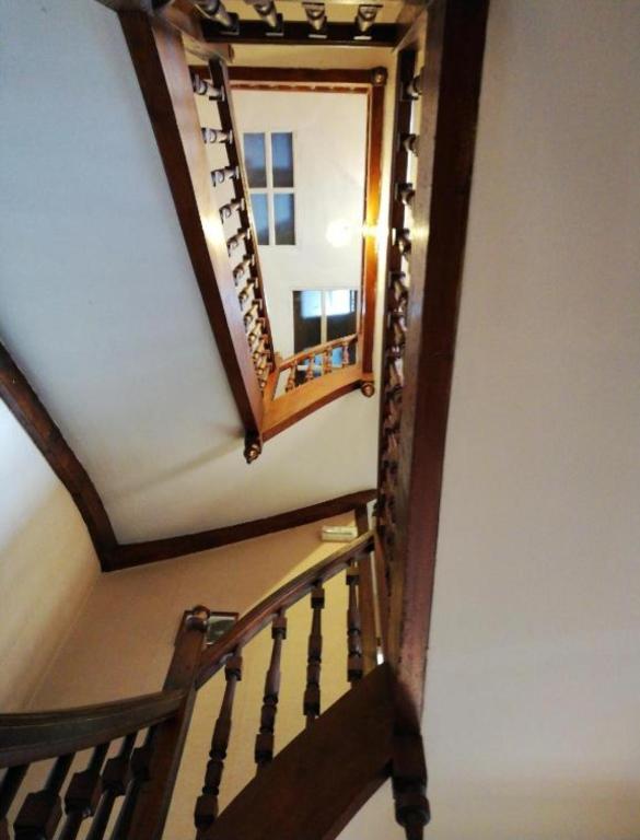 a stairway with a mirror on the wall at Gite Compostella in Saint-Jean-Pied-de-Port