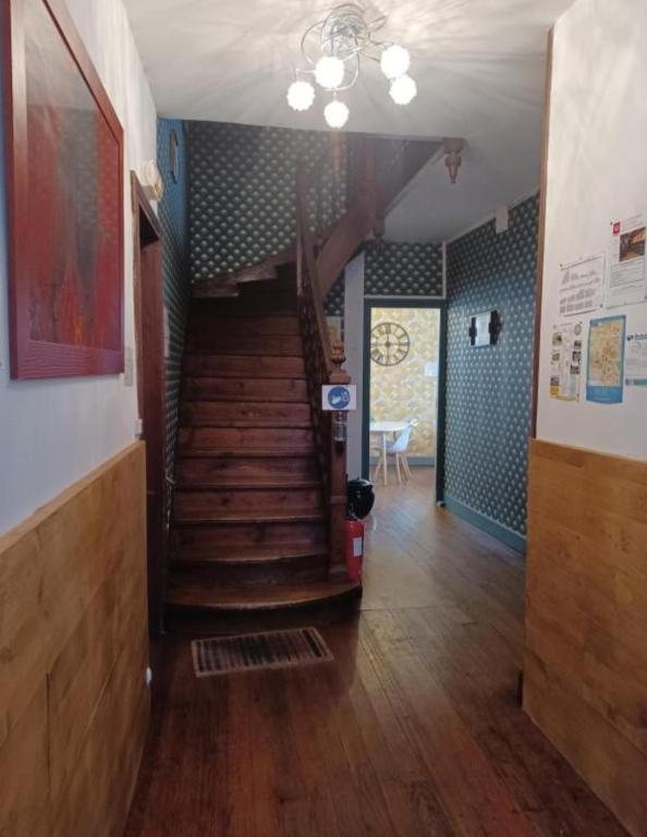 a hallway with a spiral staircase in a house at Gite Compostella in Saint-Jean-Pied-de-Port