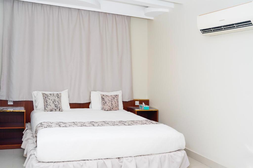 Postel nebo postele na pokoji v ubytování Palette Muscat Al Bayrahaa