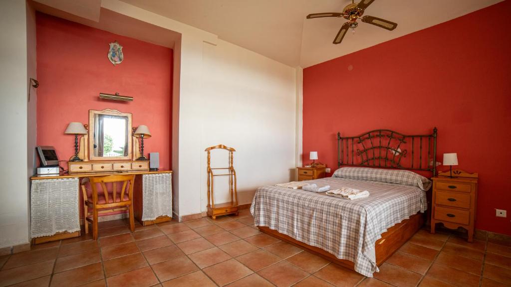 A bed or beds in a room at VILLA CANTARES