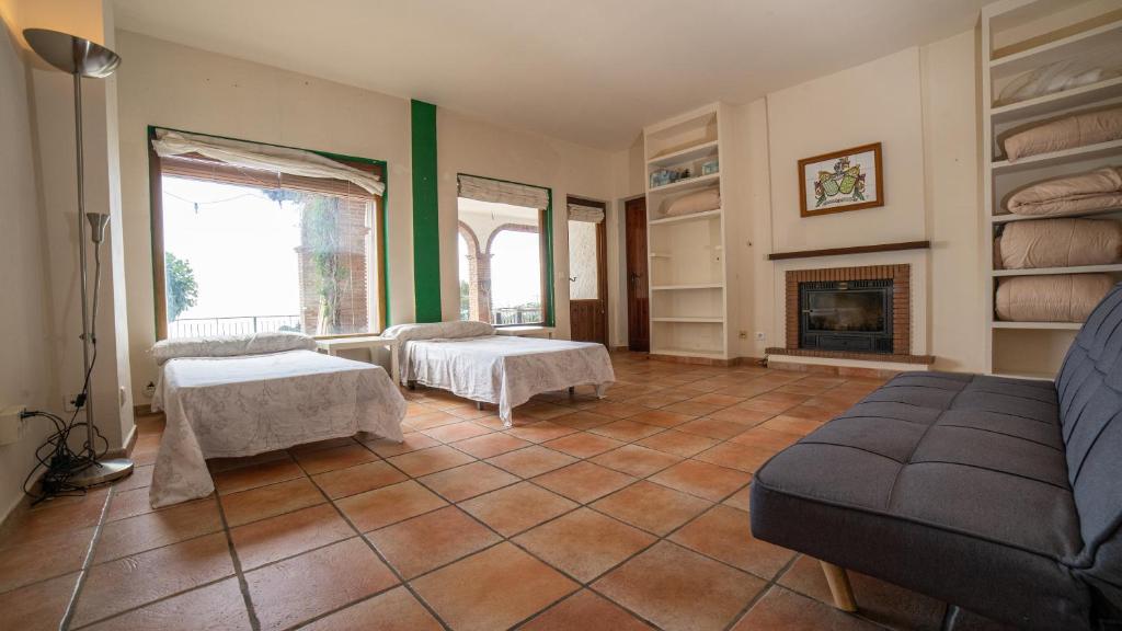A bed or beds in a room at VILLA CANTARES