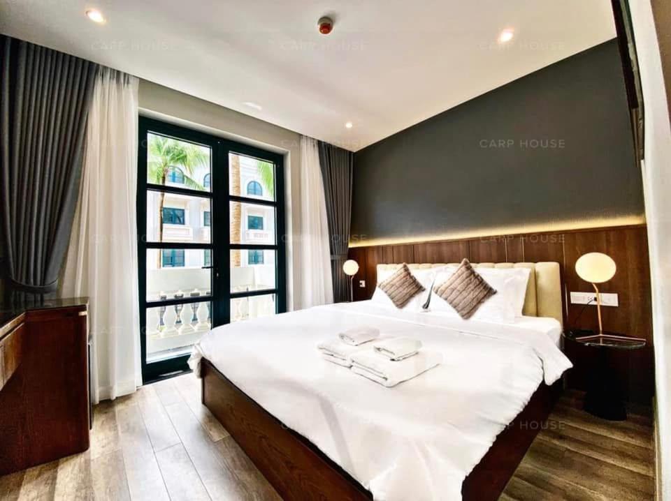 Postel nebo postele na pokoji v ubytování Carp House Phú Quốc